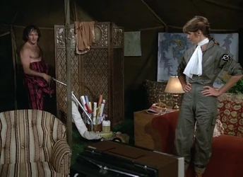 Mandy and the newly arrived Mork assess each other