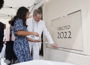 Elder David A. Bednar of Quorum of the Twelve Apostles of The Church of Jesus Christ of Latter-day Saints helps Samantha Nicerio place mortar in the cornerstone at the Yigo Guam Temple dedication in Yigo, Guam on Sunday, May 22, 2022. Photo Credit: Jeffrey D. Allred.