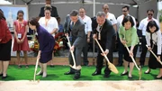 Breaking ground for the Yigo Guam Temple on May 4, 2019, are Elder Kazuhiko Yamashia (middle left) and Elder Yoon Hwan Choi (middle right) of the Seventy and their wives, Sister Tazuko Yamashita (in the purple outfit) and Sister Bon Kyung Koo Choi (in the green jacket).