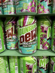 Photograph of 12 oz. cans of Dragon Fruit at a bottling plant.