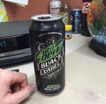 Photograph of a pre-release can of Black Label. Several other PepsiCo products, including Dewshine, can be seen in the background.