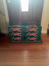 A photograph of a hoard of 12-packs 2015 Baja Blast.