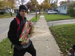 J Collado Production's brother holding a 12-pack of Holiday Brew.