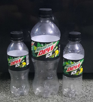 Photograph of Indian Mountain Dew Ice bottles in three different sizes.