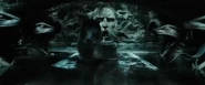 The Basilisk pursues Harry through the Chamber of Secrets.