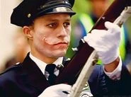 The Joker, without his makeup, while disguised as a policeman