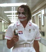 Joker gets out from the General Hospital of Gotham, dressed as a nurse with the bomb explosives trigger after making a deal with Harvey Two-Face