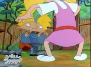 Helga's fighting with Arnold while he stands up on her.