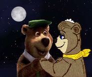 Yogi and Cindy standing by the moon.