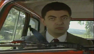 Mr. Bean in his car