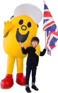 A kid meeting Mr. Adventure at Heathrow