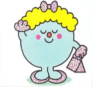 "Her shoes match her handbag, gloves and even the small bow in her hair."