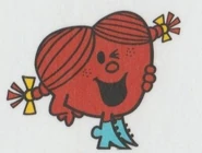 Little Miss Valentine with Little Miss Greedy's boots on the back of Little Miss books