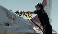 helping to refuel an F-16 Fighting Falcon using an R-11 refueler