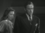 Appearing (right) in The Amazing Mr. X