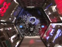 A door decorated with various bones and skeletons and two screens showing a "Movie Countdown" that opens away from the camera when opening, and to the camera when closing. This complex door was Jef Maynard's personal favorite, and was intended as something of an homage to the KTMA door sequence. Materials to make it included an assemblage of toys and driftwood.[1]