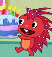 Flaky holding a cake for birthday.