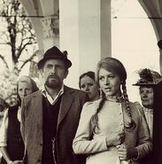 The Fox and Meta outside of the church with Bičkova and Winni in the background.