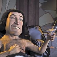 Farquaad in bed with a martini.