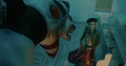 Betelgeuse confronting a Sandworm while dressed as a matador in Beetlejuice Beetlejuice