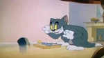Tom trying to bribe Jerry with a piece of cheese attached to a mouse trap, as seen in "Mouse Trouble".