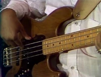 tune is slower than the others; starts with close-up of guitar and bass, then close profile shot of drums moving to cymbal, then bass; time is approx. 1:34, appears in Episode 1843