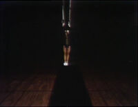 'Close To' and 'Away From' She repeatedly swings on a pair of rings - to and from the viewer. (First: Episode 0513)