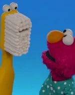 toothbrush in How to Brush Your Teeth with Elmo