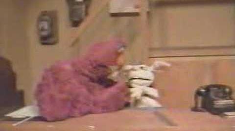 Telly_Monster_Drop_Kicks_Rapid_T._Rabbit_off_Sesame_Street