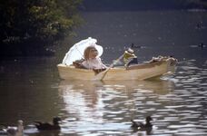 Kermit and Miss Piggy rowing a rowboat in The Muppet Movie