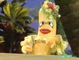 A Carmen Miranda Banana singing "One Banana"