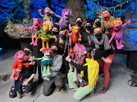 puppeteers with Fraggles rigged to give Red high-fives during "I Knew I Was Good"