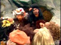 A chorus of stone age pigs singing "Yakkety Yak"