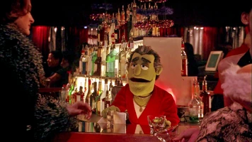 Johnny Fiama, bartender at Club Dot in the world in which Kermit was never born.
