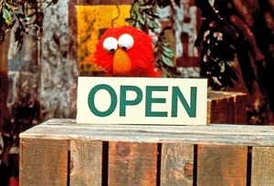 Elmo learns about the word "OPEN" in .