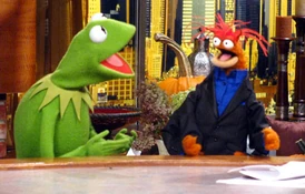 Blue dress shirt and black suit jacket.