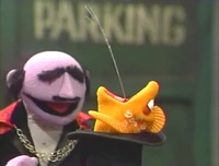 A fish spits water in Sesame Street Episode 3005