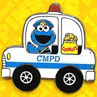 Cookie Monster driving a police car