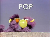 Two-Headed Monster blows up a balloon on Sesame Street