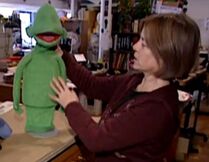 Puppet builder Rollie Krewson with a blank Green puppet