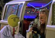as "Rainbow" the hippie, giving Dr. Bunsen Honeydew and Beaker a lift to Cape Doom in Muppets from Space