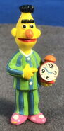 Bert ready for bed with a clock