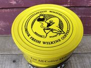 A Wilkins Coffee plastic lid with Wilkins and Wontkins