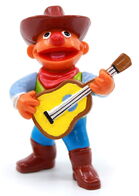 Ernie dressed as a cowboy with a guitar