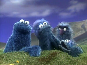 Cookie Monster with his blue family.