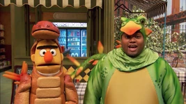 Episode 4608 Ernie and Bert appear throughout as part of the dinosaur ensemble