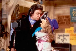 Cash with Miss Piggy on The Muppet Show.