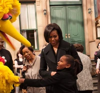 Michelle and Sasha Obama meeting Big Bird during a 2010 visit to the Sesame Street set.