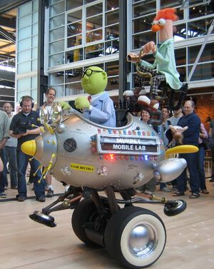 Pete Docter (seen above the vehicle's headlights) enjoys the 's visit to Pixar Animation Studios on March 12, 2007.