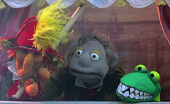 A Whatnot puppeteer and Punch and Judy puppets